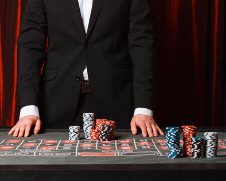 Man placing a bet at the casino., studio shotの写真素材