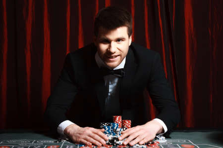 man playing at the casino. studio shotの写真素材