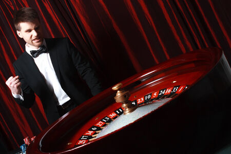 man playing at the casino. studio shotの写真素材