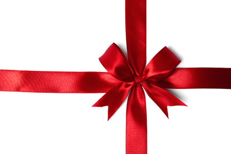 Shiny red satin ribbon on white background. studio shotの写真素材