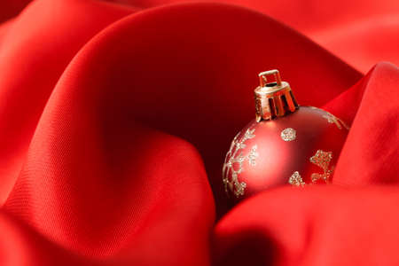 red Christmas balls, wrapped in red cloth. studio shotの写真素材
