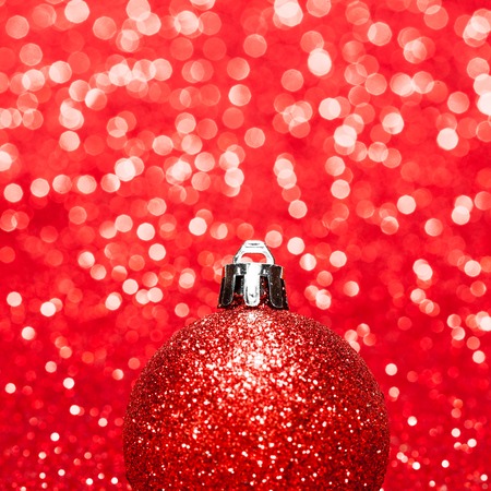 Beautiful red christmas balls on abstract glitter background close-upの写真素材