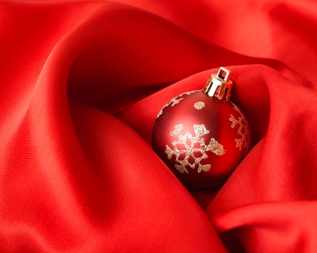 red Christmas balls, wrapped in red cloth. studio shotの写真素材
