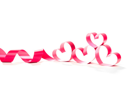 Ribbons shaped as hearts on white, valentines day conceptの写真素材