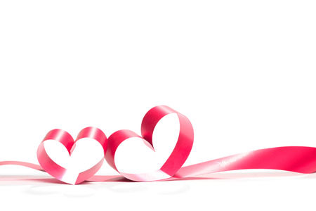 Valentine Heart. Elegant Red satin gift Ribbon. Isolated on whiteの写真素材