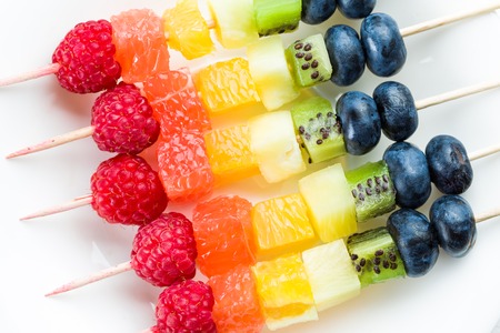 Mixed fruits and berries on skewers. studio shotの写真素材