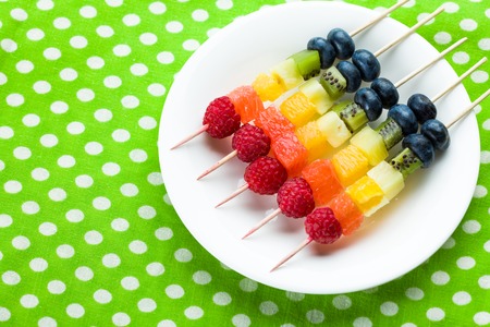 Mixed fruits and berries on skewers. studio shotの写真素材