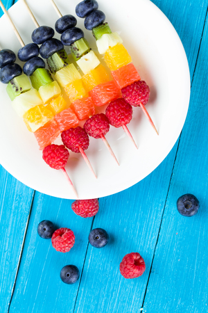 Mixed fruits and berries on skewers. studio shotの写真素材