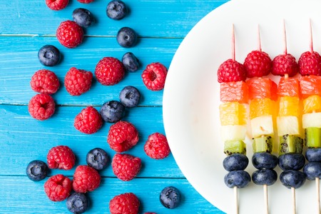 Fresh summer fruits on sticks. Studio shotの写真素材