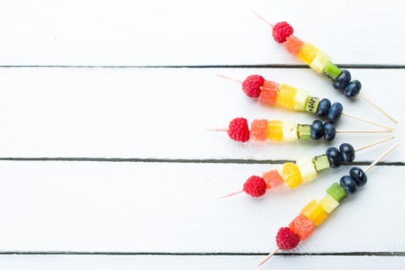 Fresh summer fruits on sticks. Studio shotの写真素材