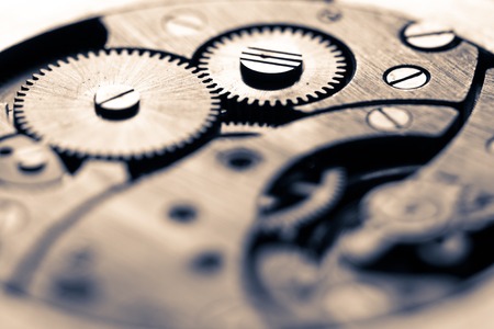 Mechanism of pocket watch with grunge texture.