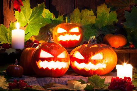 Halloween pumpkin head on wooden background. Studio shotの写真素材