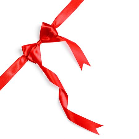 Red ribbons with bow with tails isolated on white backgroundの写真素材