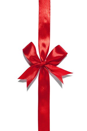 Red ribbon bow on white backgroundの写真素材