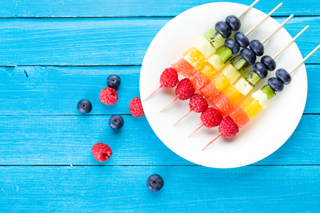 Fresh summer fruits on sticks. Studio shotの写真素材