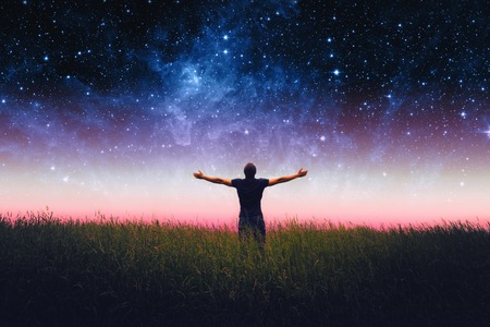 Silhouette of man and stars sky. Elements of this image furnished by NASAの写真素材