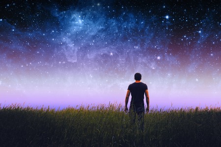 Silhouette of man and stars sky. Elements of this image furnished by NASAの写真素材