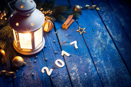 Magical Lantern On Wooden background With Christmas Decoration. Happy new year