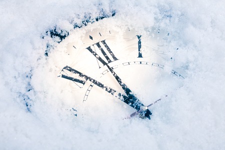 Christmas Time Clock under snow. studio shotの写真素材