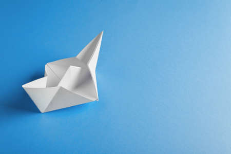 boat paper origami on the blue backgroundの写真素材