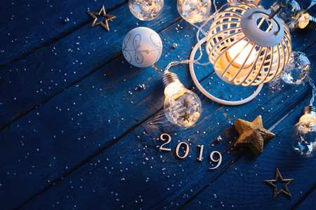 Christmas Lantern with decorations on blue wooden backgroundの写真素材