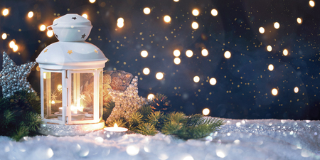 Christmas Lantern On Snow With Fir Branch In Evening Sceneの写真素材