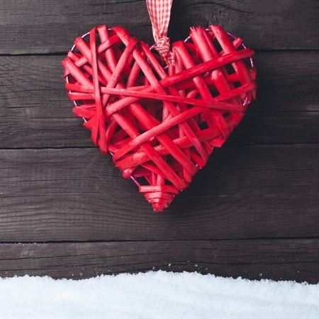 Heart over a wooden background. Valentines day greeting card