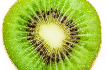 Slice of kiwi fruit isolated on white backgroundの写真素材