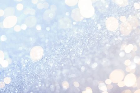 Chritmas light background with snow and gold lights. Design backgroundの写真素材