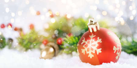 Christmas ball and fir branches with decorationsの写真素材