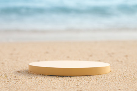 Empty round beige platform podium on the beach sand.の写真素材