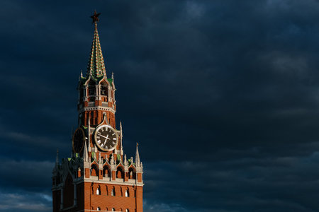 Moscow Kremlin Tower with clocks Kuranty against dark skyの写真素材