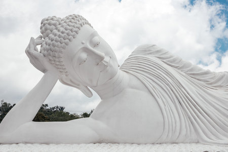 Buddha statue with closed eyes in the jungle. high quality photoの写真素材