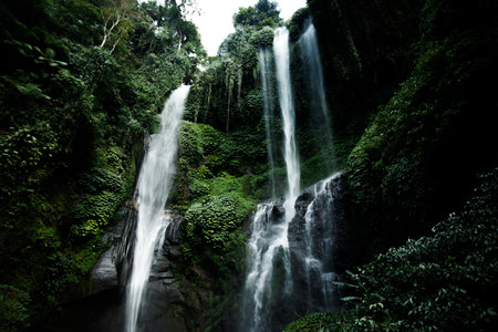 Background of jungle waterfall cascade in tropical rainforest