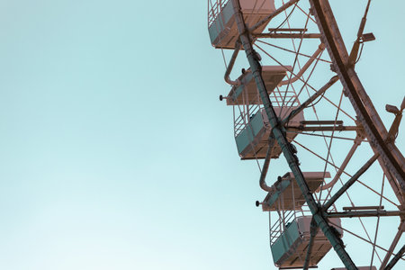 Close-up of a white ferris wheel against the sky
