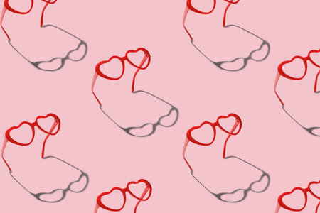 Pattern made with red heart shaped sunglasses on pastel color background. Valentine day concept.の写真素材