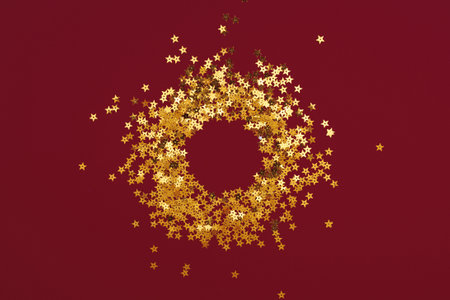 Round gold frame or border of random scatter golden stars, flat layの写真素材