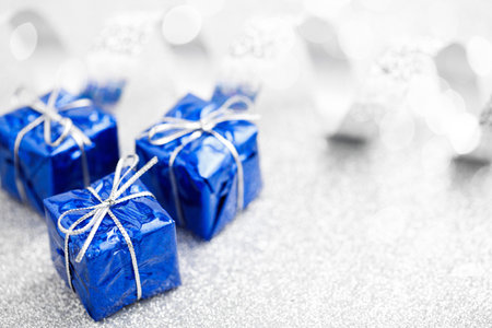 Three blue gift boxes for Christmas decoration on white backgroundの写真素材