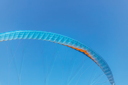Colorful paraglider close-up against the blue sky. High quality photoの写真素材