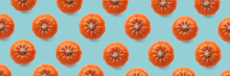 Orange pumpkin pattern on pastel color background. Halloween pumpkin background. Autumn concept.の写真素材