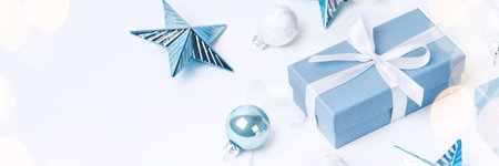 Christmas blue gifts with decorations on white background, copy spaceの写真素材