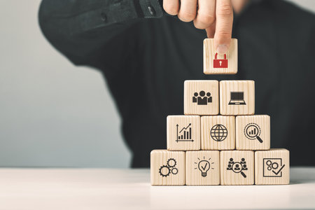 Assembled wooden cubes on the topic of cyber security leadership in business and life.の写真素材
