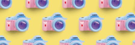 Pattern with camera on pastel color background, top viewの写真素材