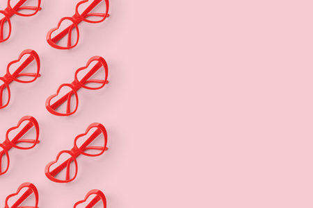 Pattern made with red heart shaped sunglasses on pastel color background. Valentine day concept.の写真素材