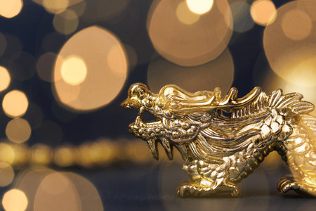Golden dragon on a dark backgroundの写真素材