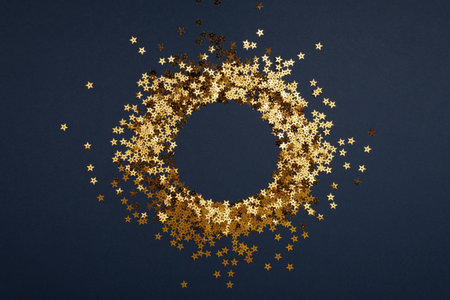 Round gold frame or border of random scatter golden stars, flat layの写真素材