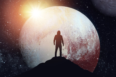 Silhouette of a man against the backdrop of the planet.の写真素材