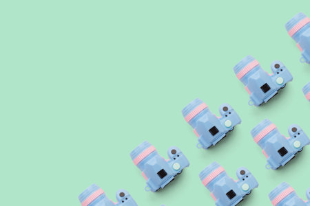 Pattern with camera on pastel color background, top viewの写真素材