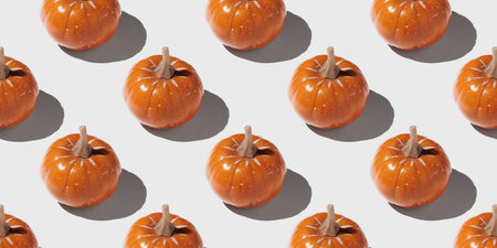 Orange pumpkin pattern on pastel color backgroundの写真素材