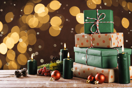 Christmas gift boxes with decoration on the tableの写真素材